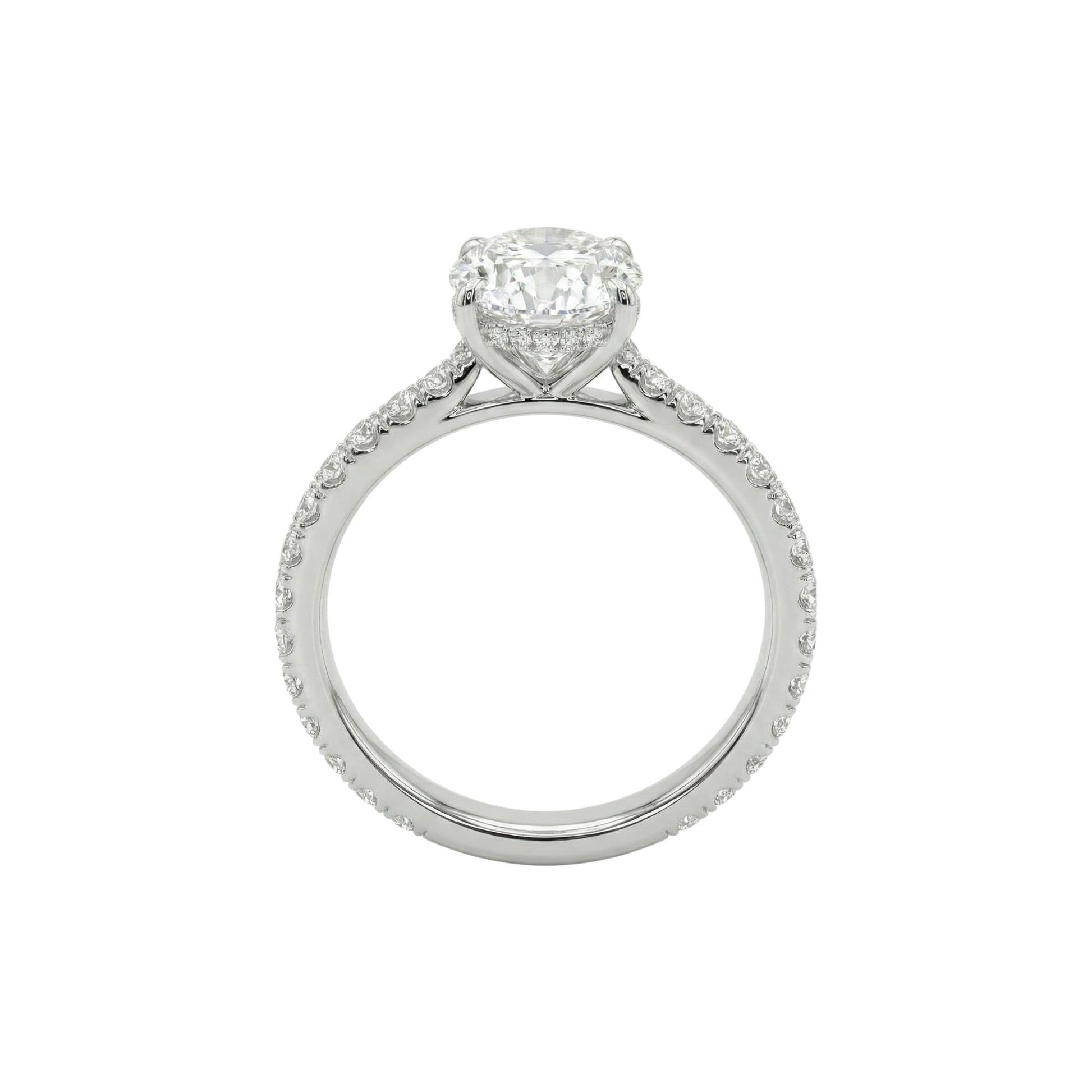 Diamond ring with a heart-shaped center stone on a white background