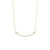Gold necklace with small beads on a white background