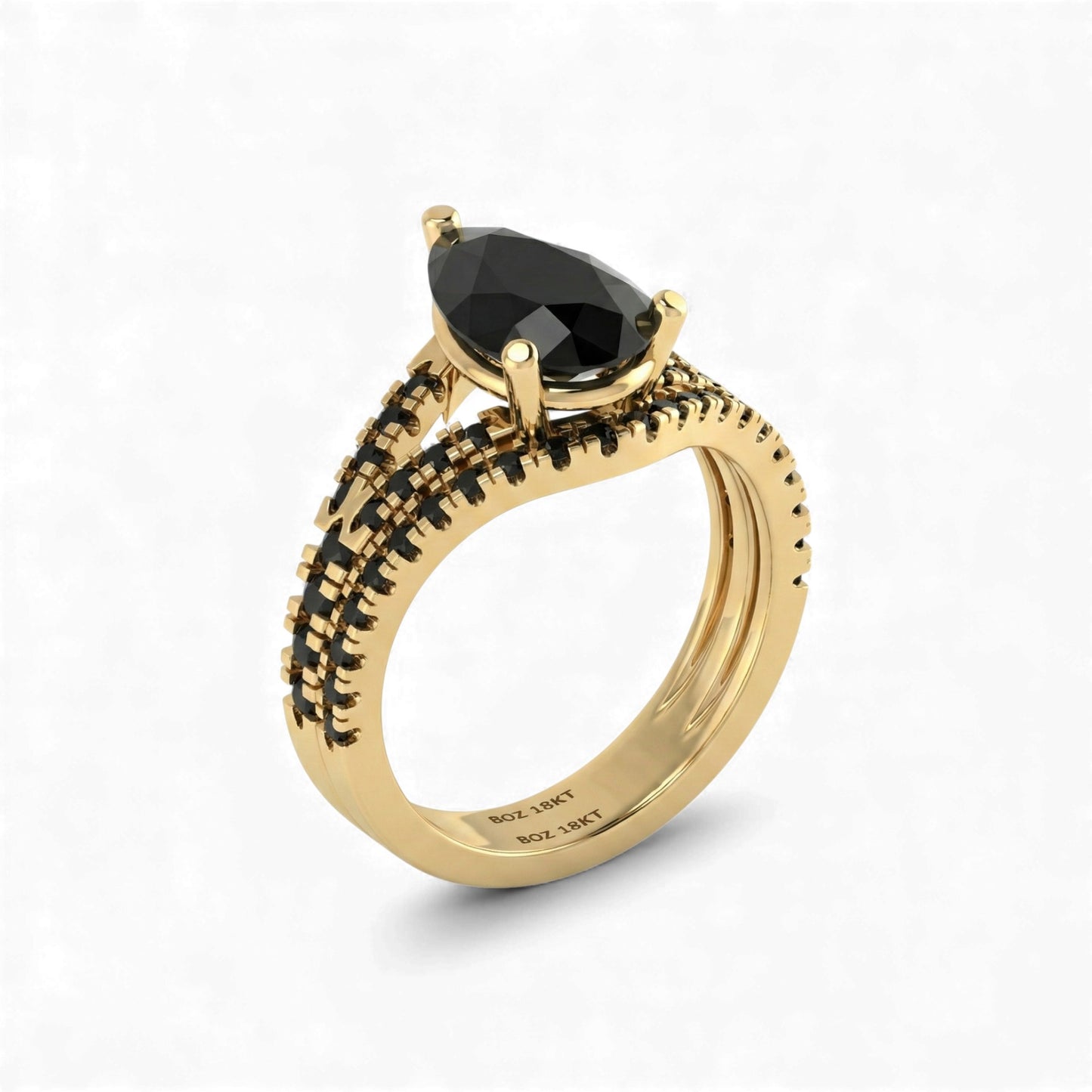 Gold ring with a black gemstone on a white background
