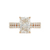 Rose gold ring with a large diamond and smaller diamonds on the band against a white background