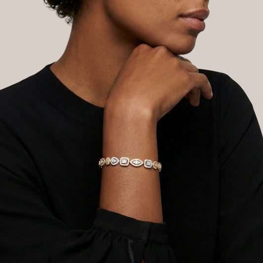 Person wearing a bracelet with a neutral background