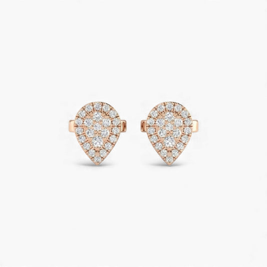 Heart-shaped earrings with rose gold and clear gemstones on a white background