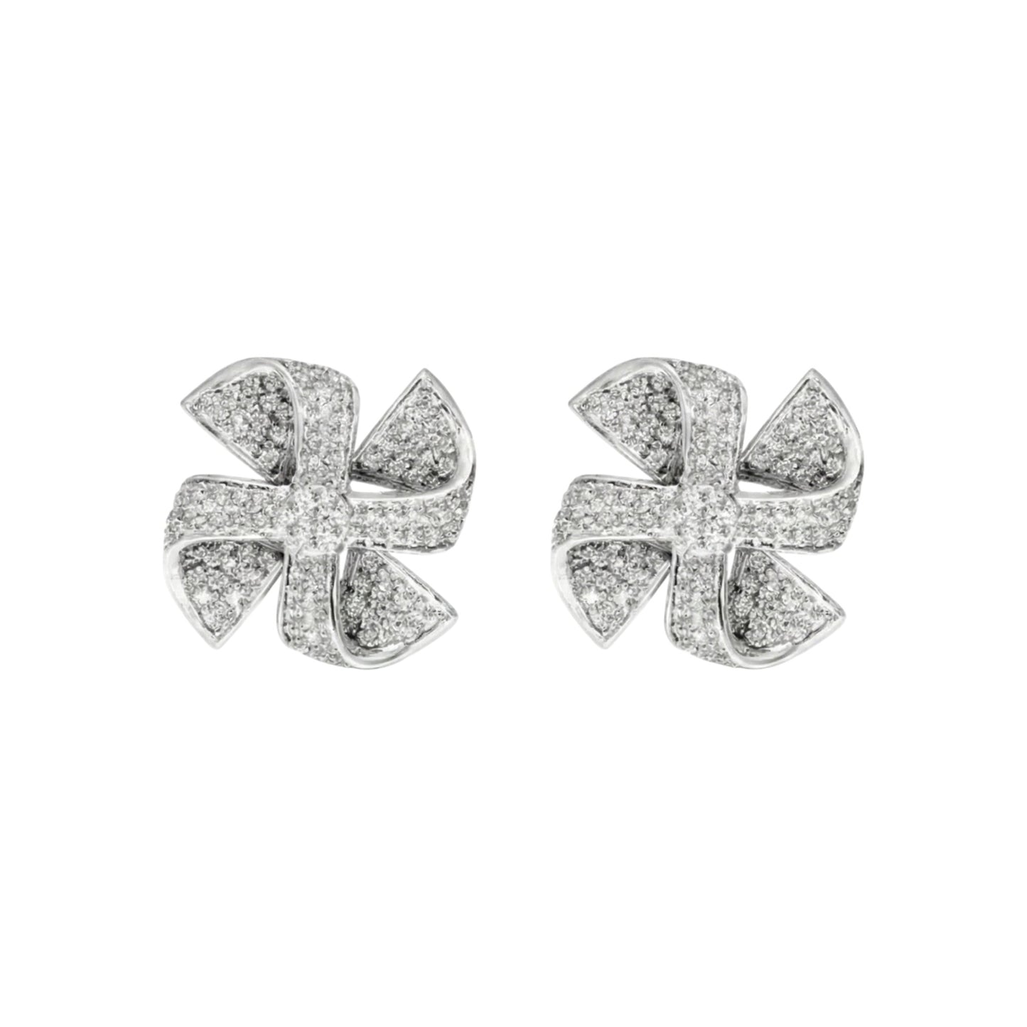 Pair of silver earrings with diamond-like stones on a white background