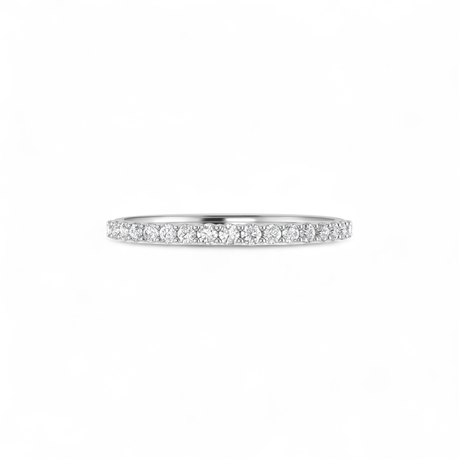 Silver ring with small diamonds on a white background