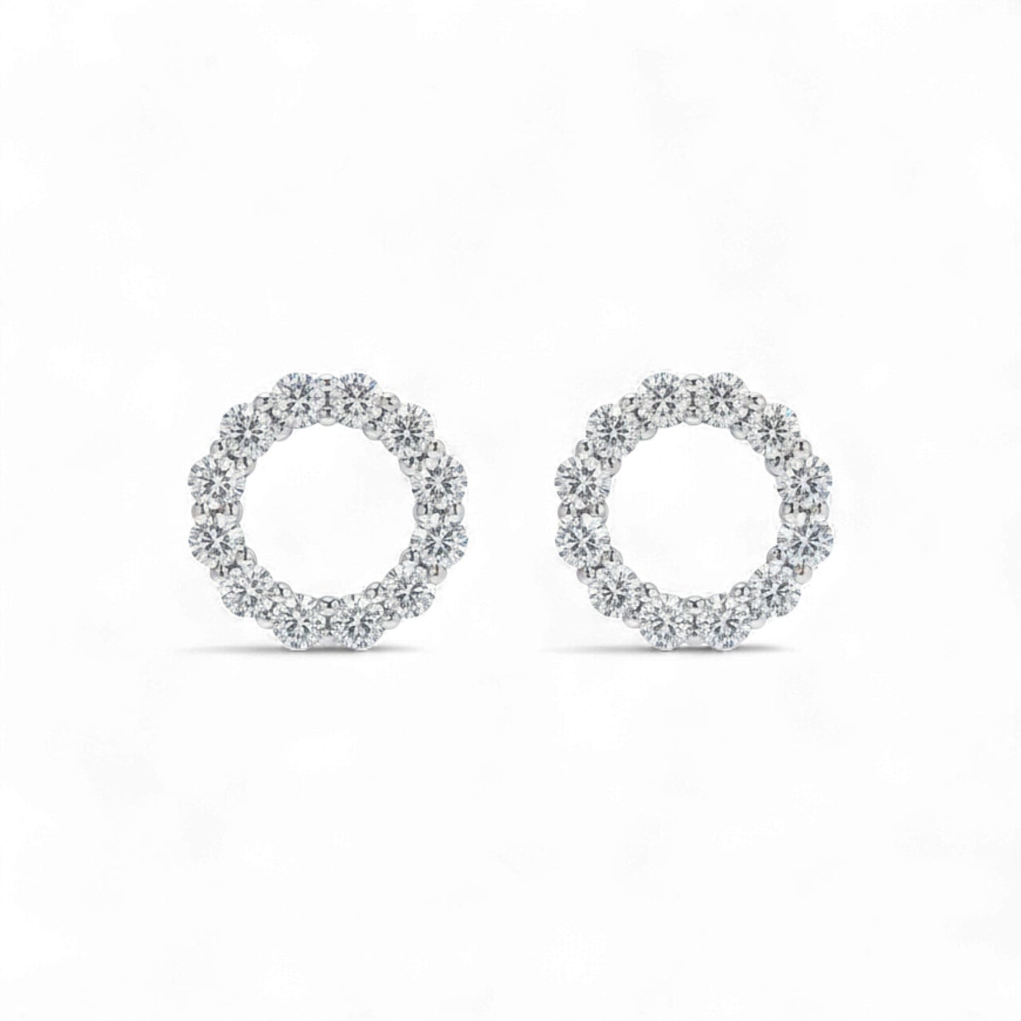Pair of silver hoop earrings on a white background