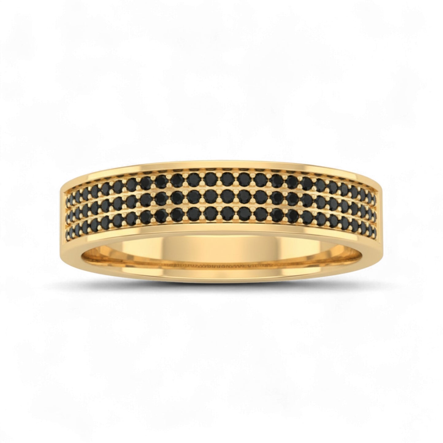 Gold ring with black gemstones on a white background