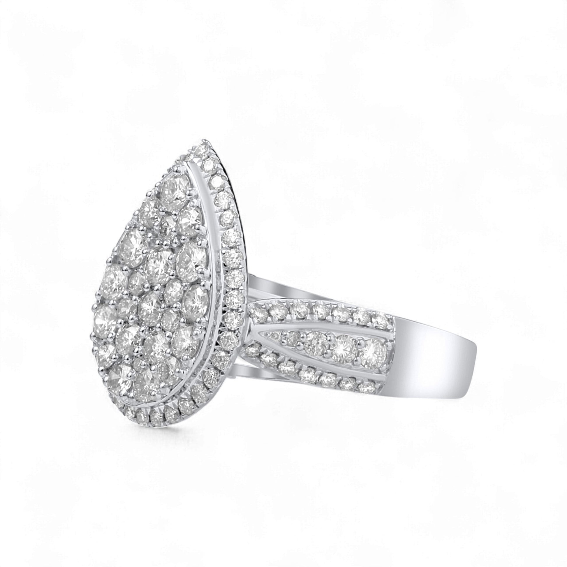 Silver ring with a teardrop-shaped diamond cluster on a white background