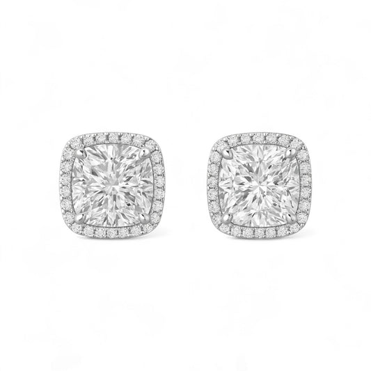 Pair of diamond earrings on a white background