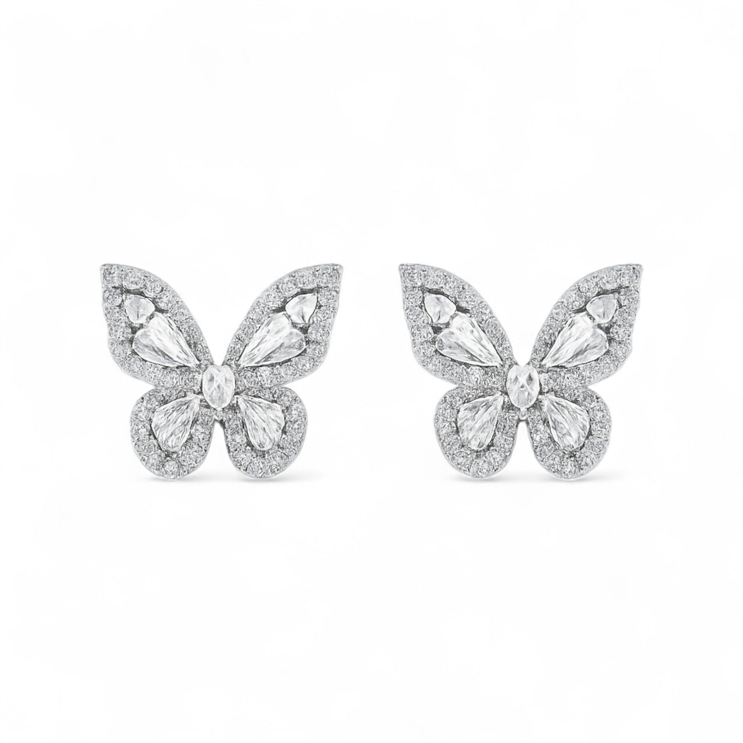 Butterfly-shaped earrings with gemstones on a white background