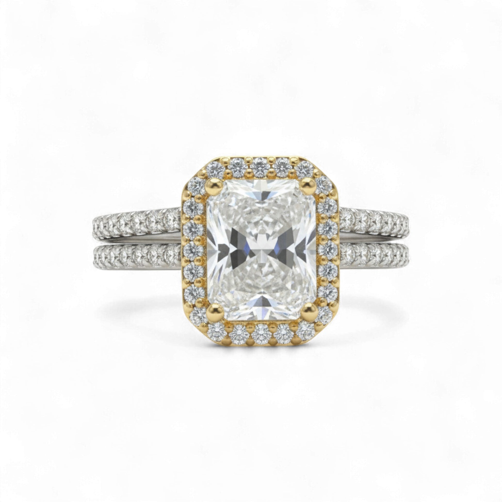 Diamond ring with gold and silver band on a white background