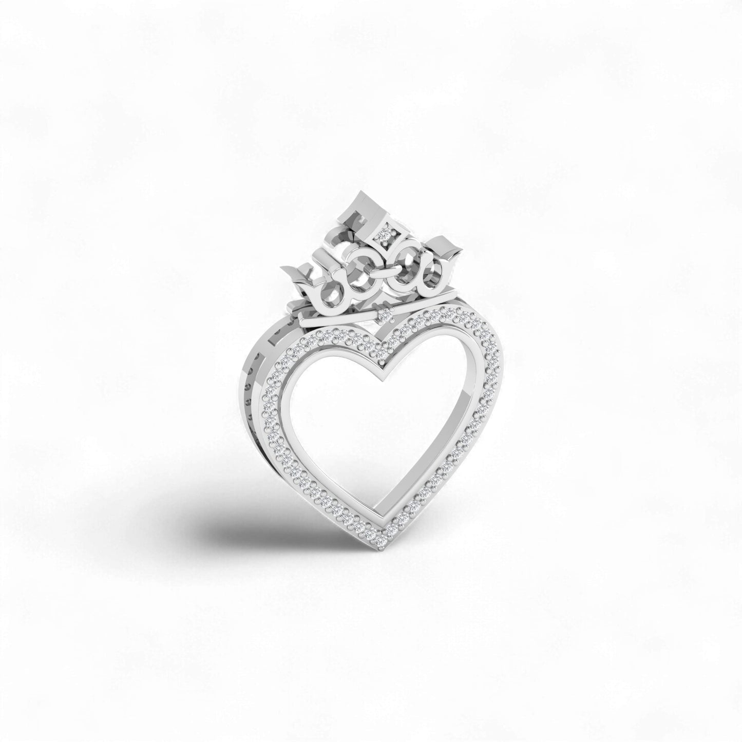 Silver heart-shaped ring with a crown-like top on a white background