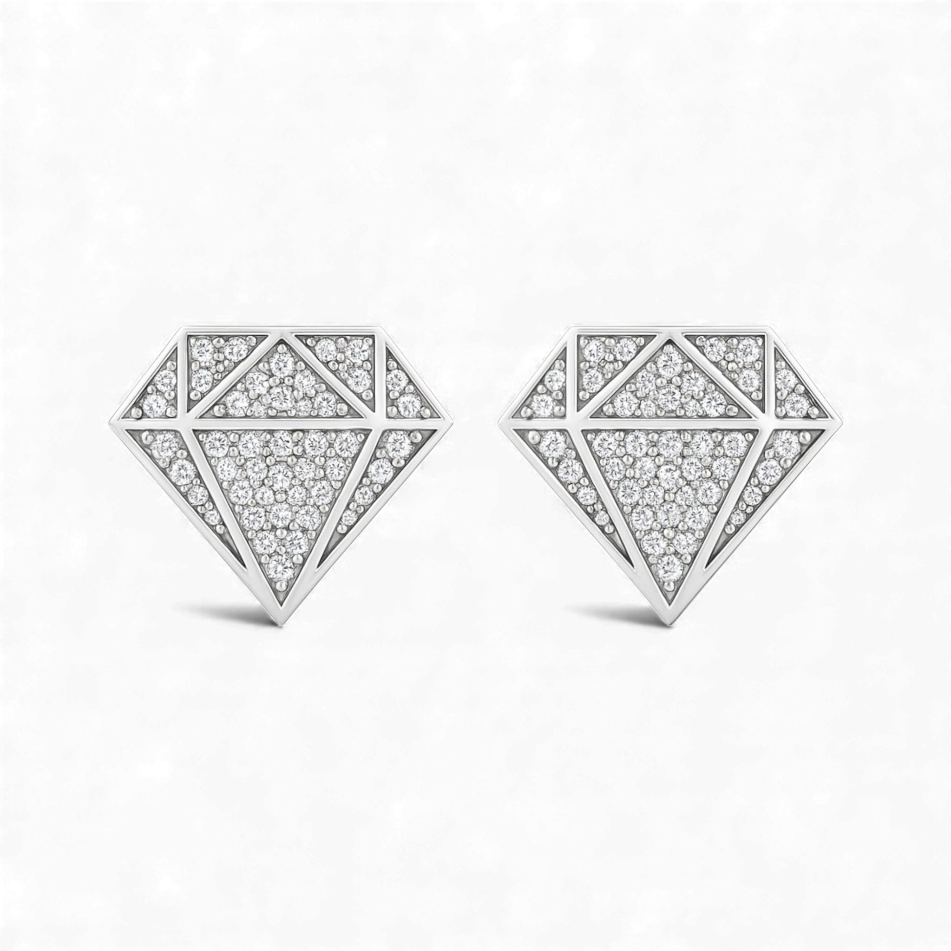 Diamond-shaped earrings with a geometric design on a white background