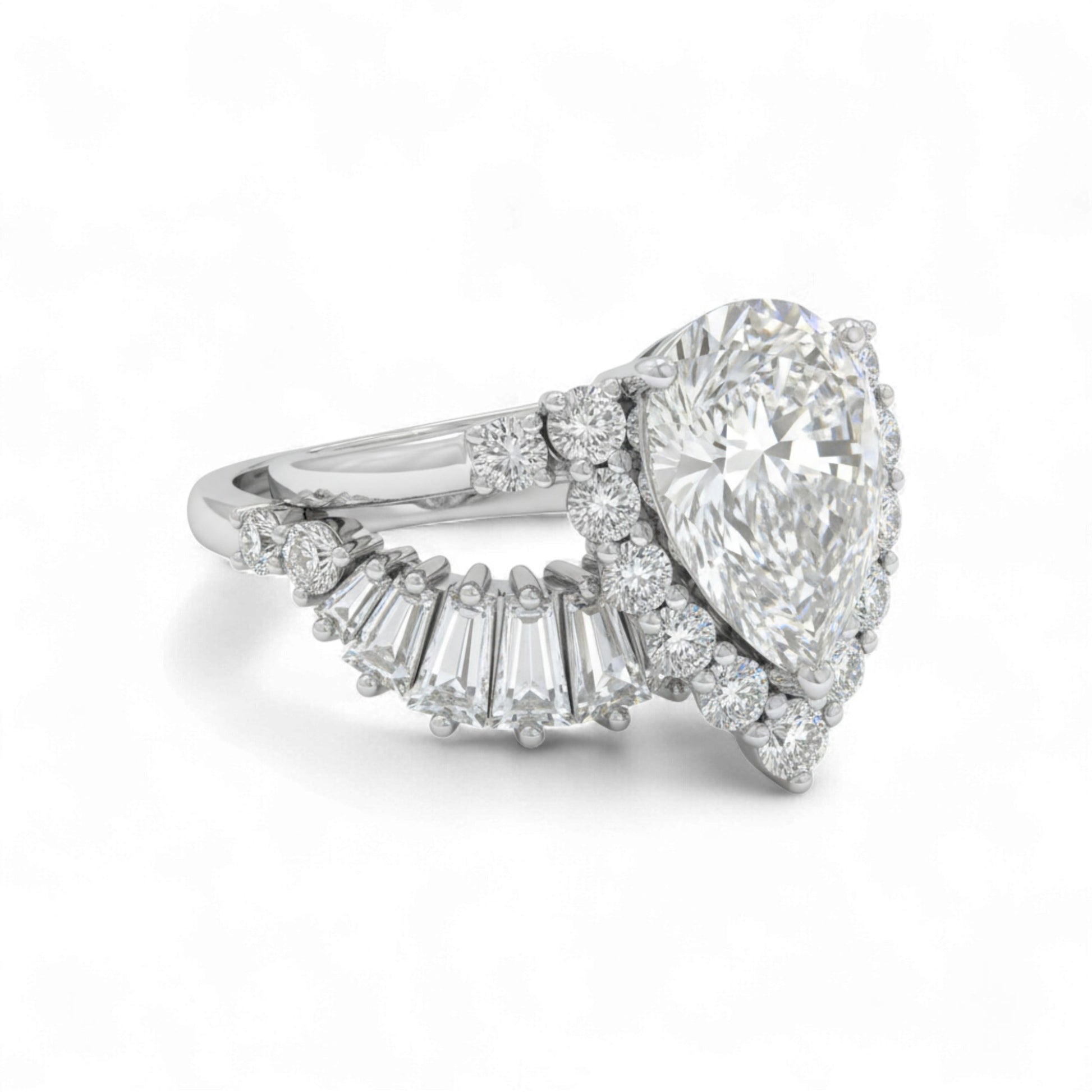 Diamond ring with pear-shaped center stone and baguette side stones on a white background