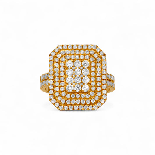 Gold ring with diamond accents on a white background