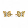 Gold butterfly earrings with diamond centers on a white background