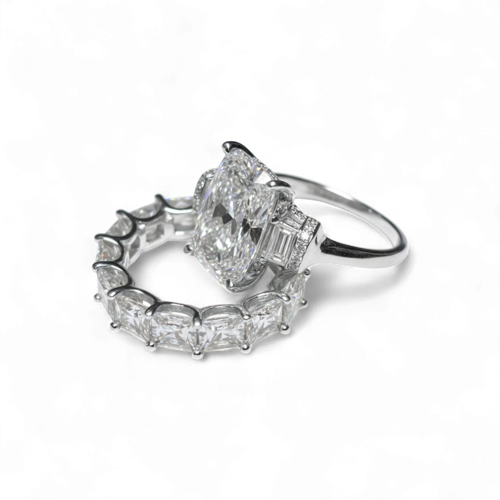 Two diamond rings on a white background