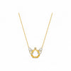 Gold necklace with a horse shoe pendant on a white background