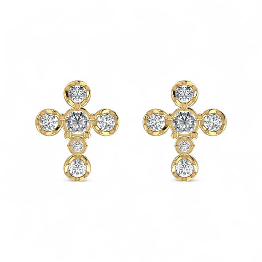 Gold earrings with clear gemstones on a white background