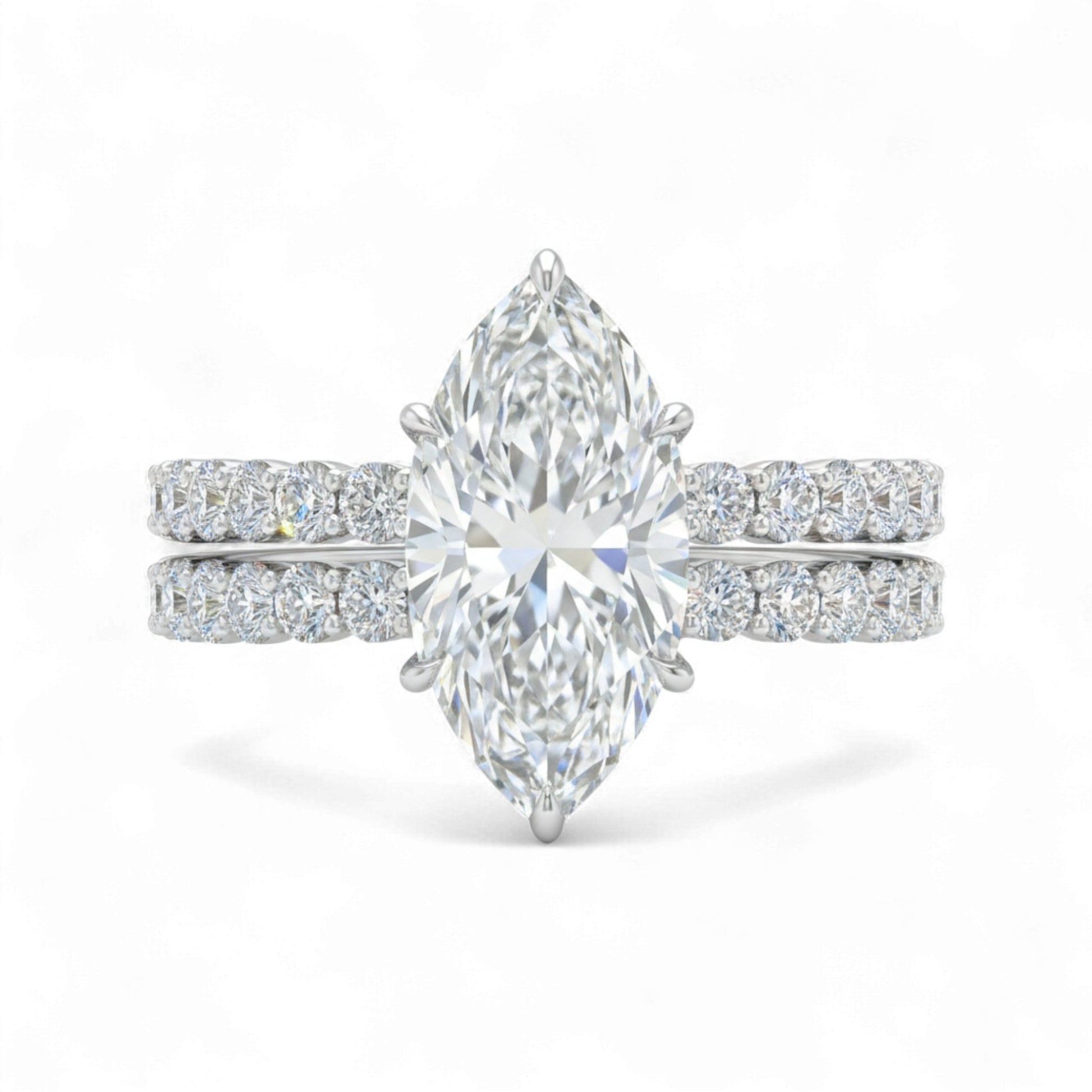 Diamond ring with pear-shaped center stone on a white background