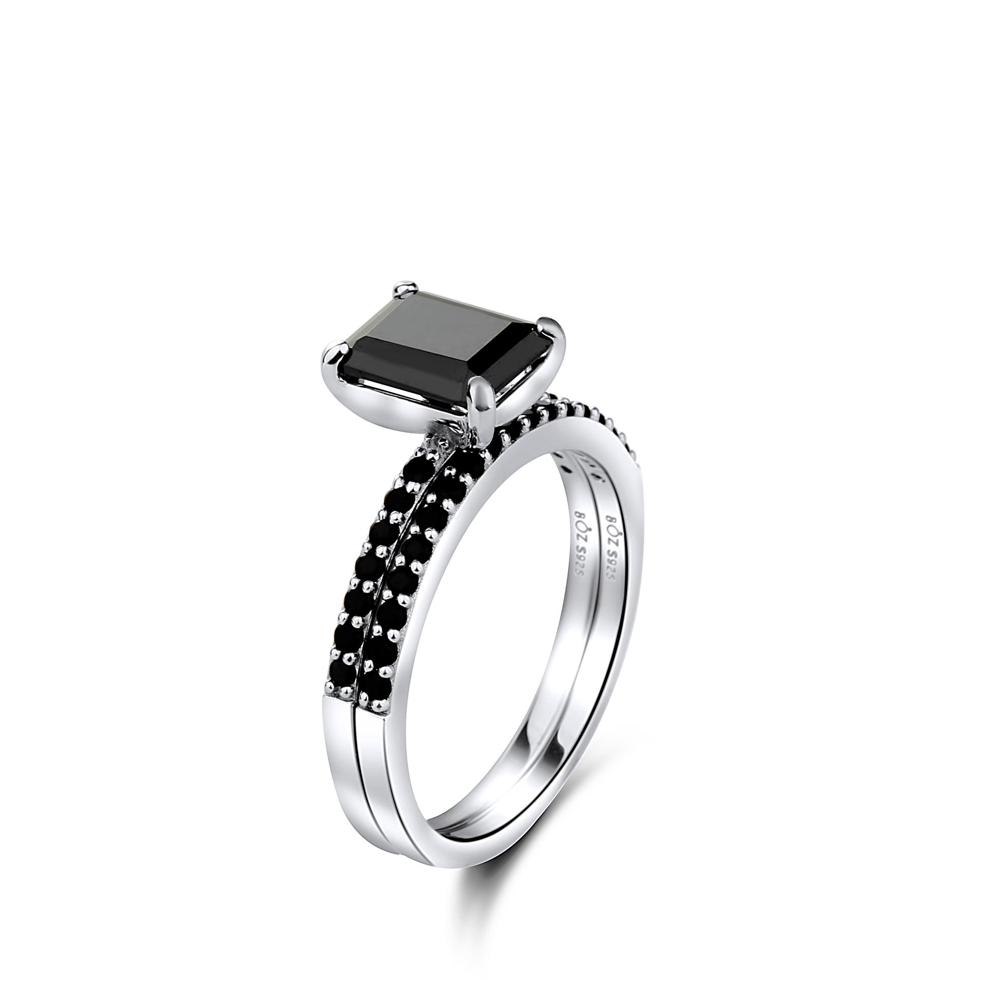 Silver ring with a black gemstone on a white background