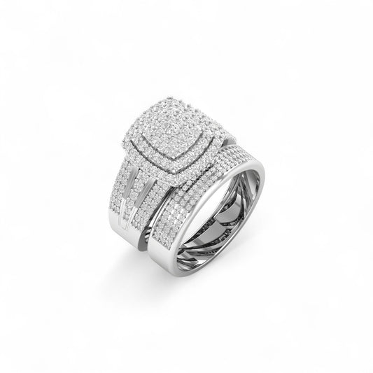 Silver ring with intricate design on a white background