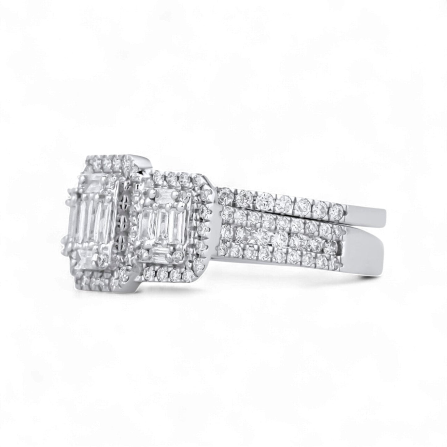 Diamond ring with emerald-cut center stone on a white background