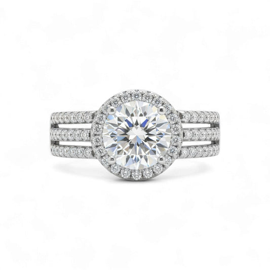 Diamond ring with a halo and side stones on a white background