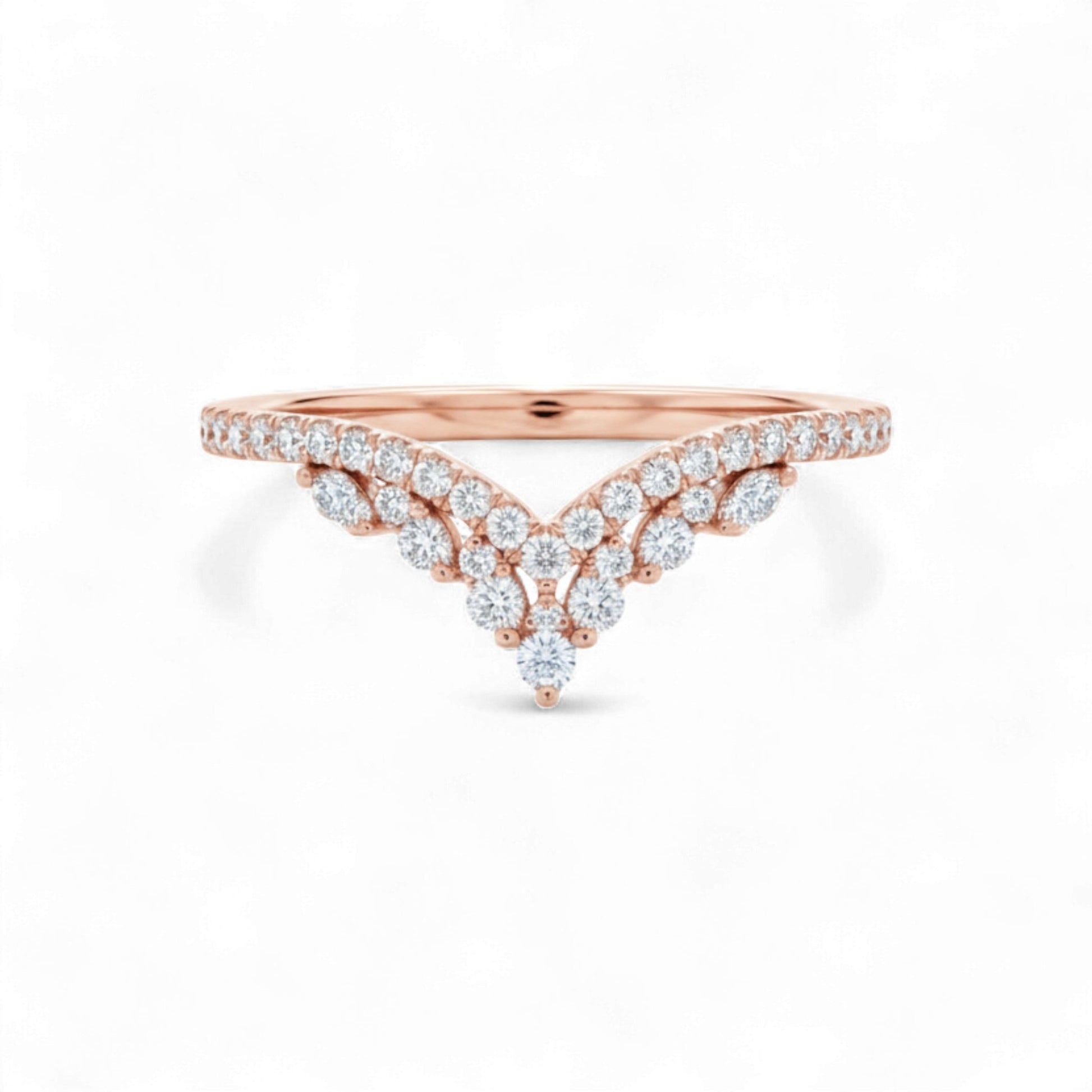 Rose gold ring with diamond accents on a white background