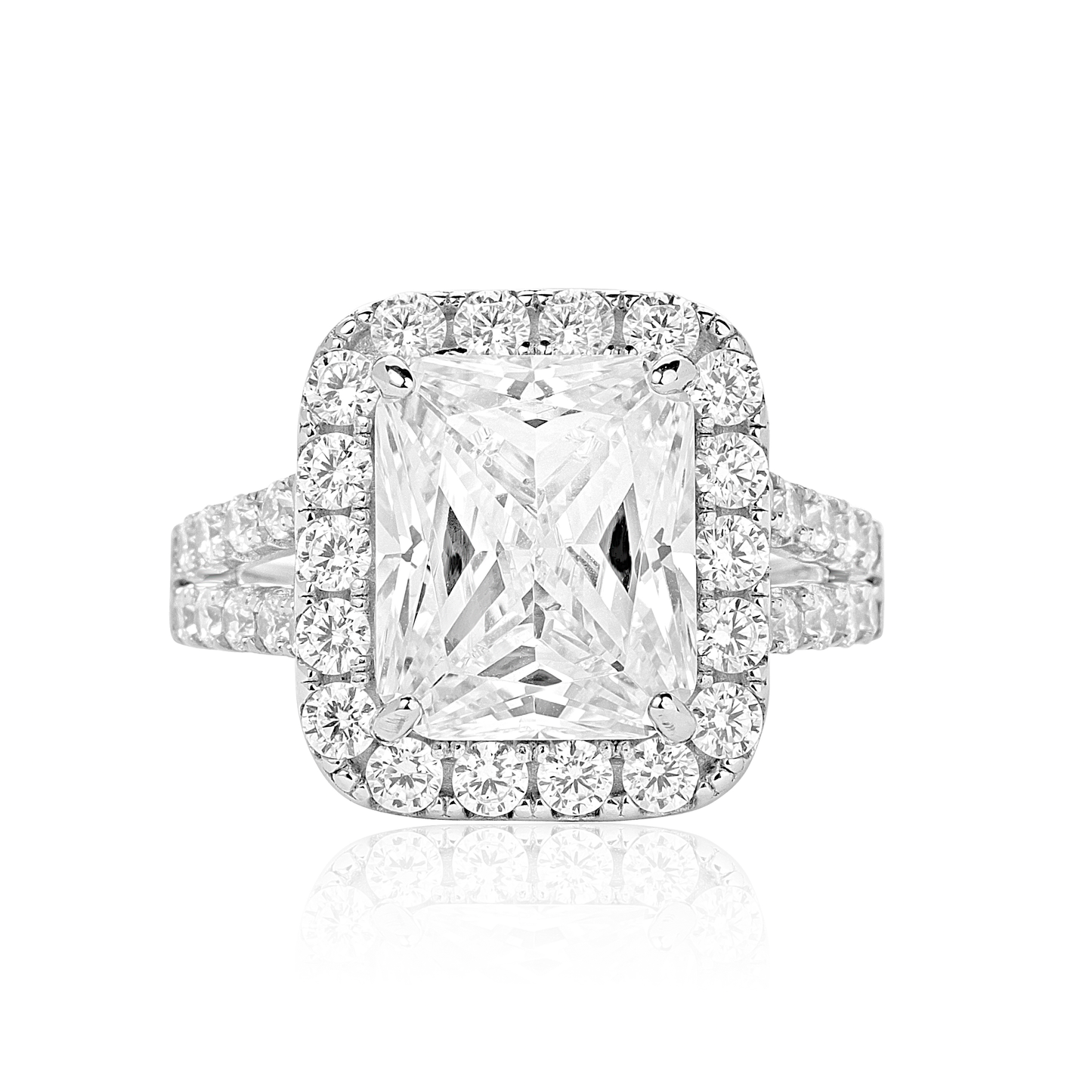 Diamond ring with a rectangular center stone on a white background