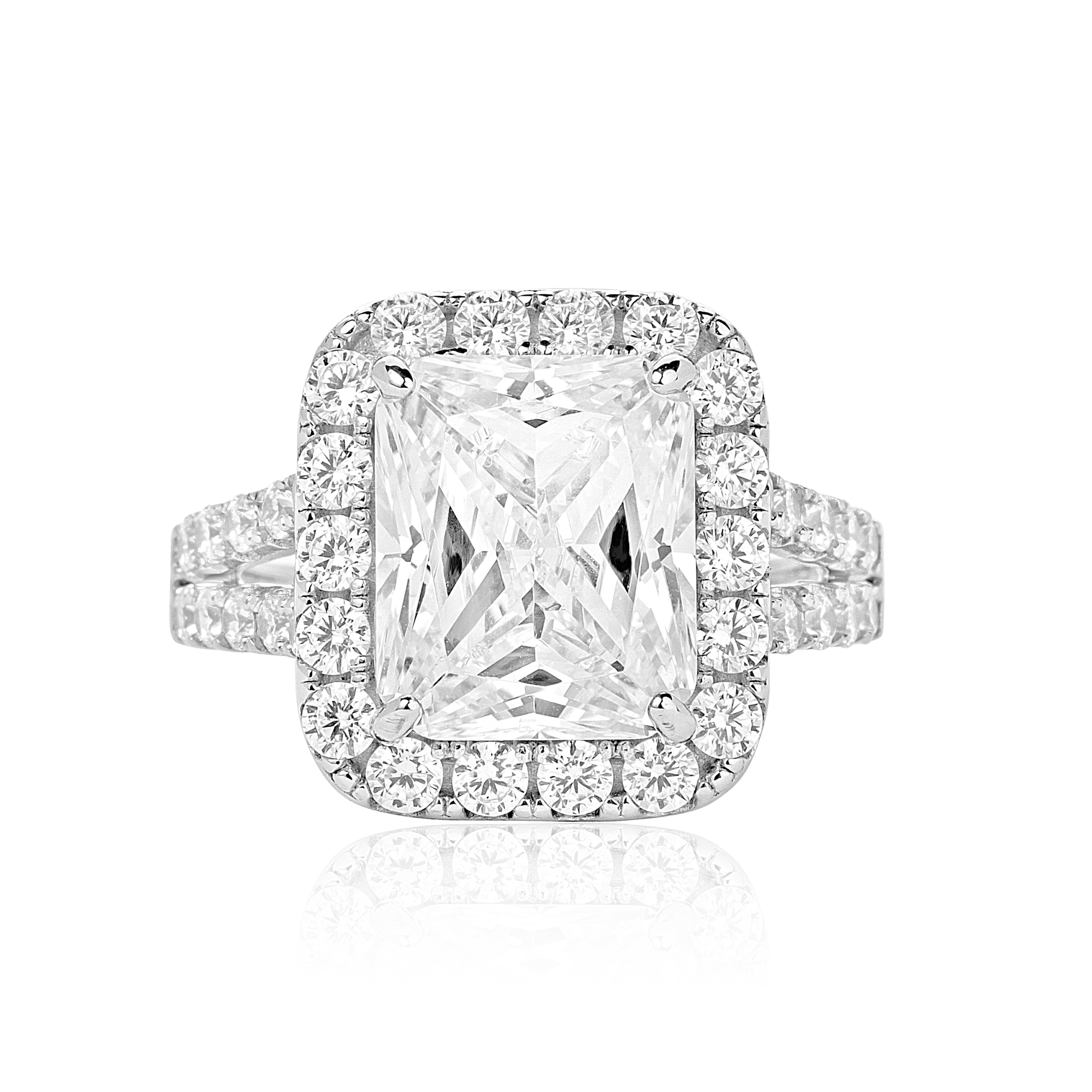 Diamond ring with a rectangular center stone on a white background