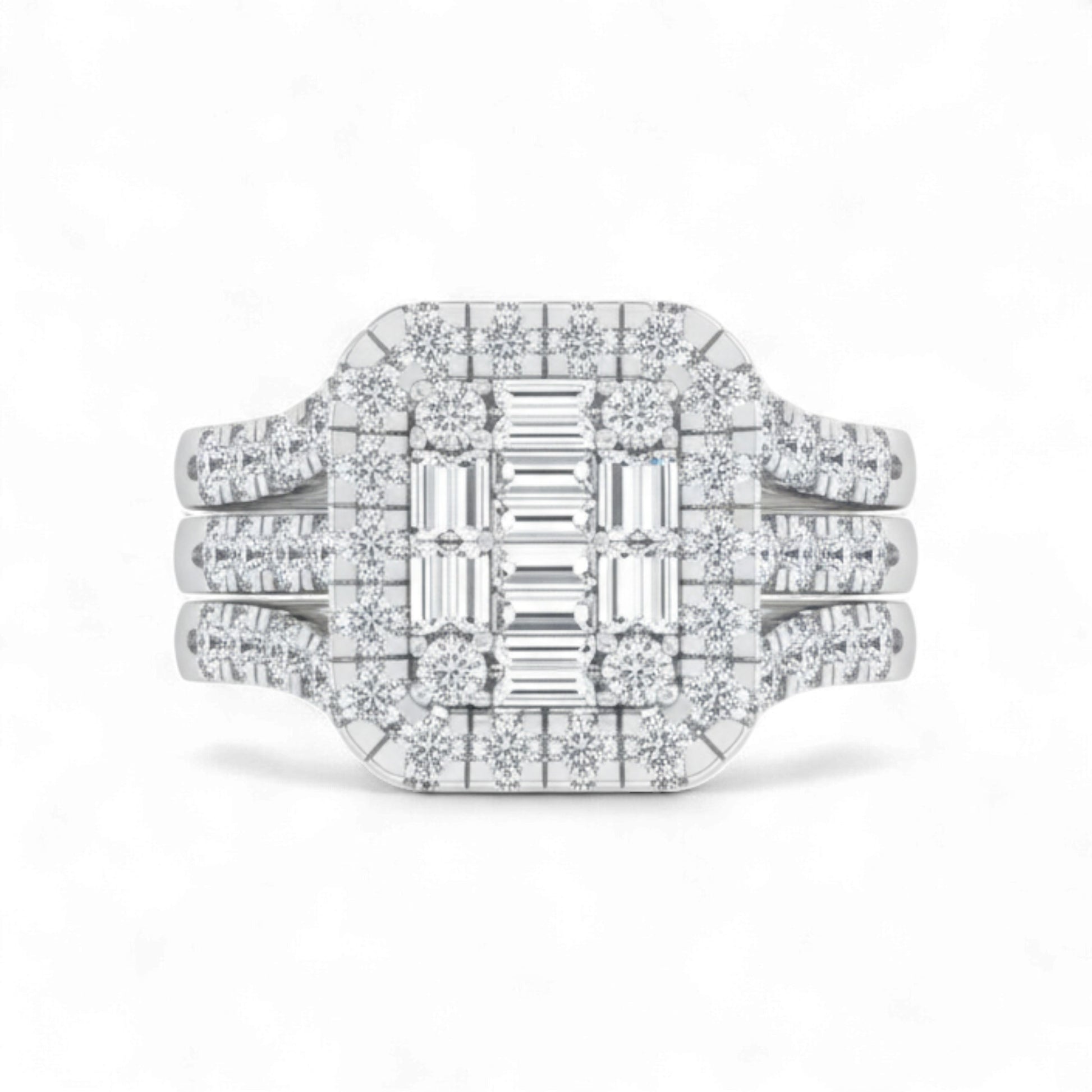 Diamond ring with emerald-cut center stone on a white background