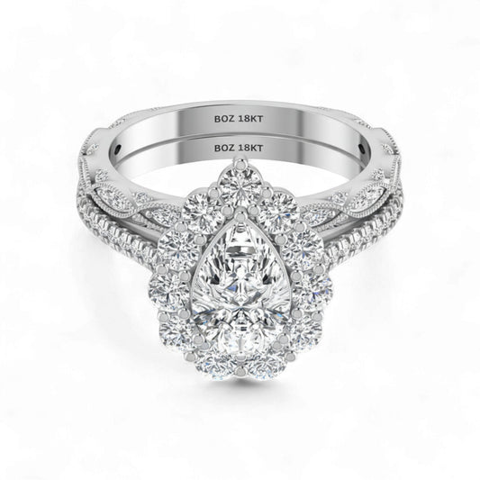 Silver ring with a pear-shaped diamond on a white background