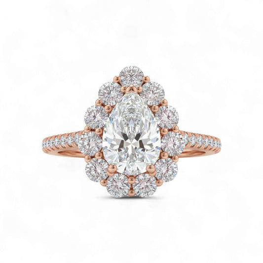 Rose gold ring with a large pear-shaped diamond and smaller diamonds on a white background