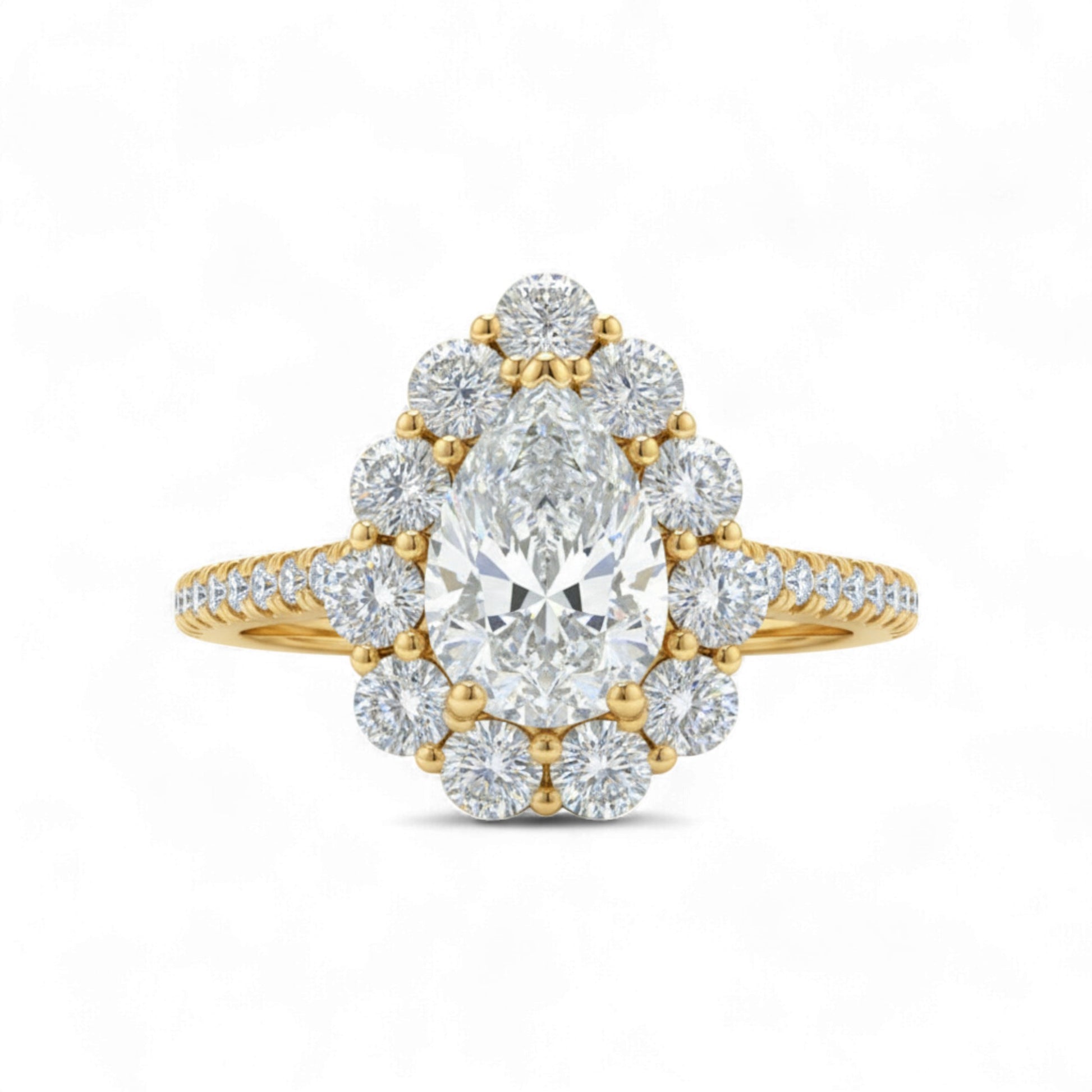 Gold diamond ring with a central pear-shaped diamond on a white background