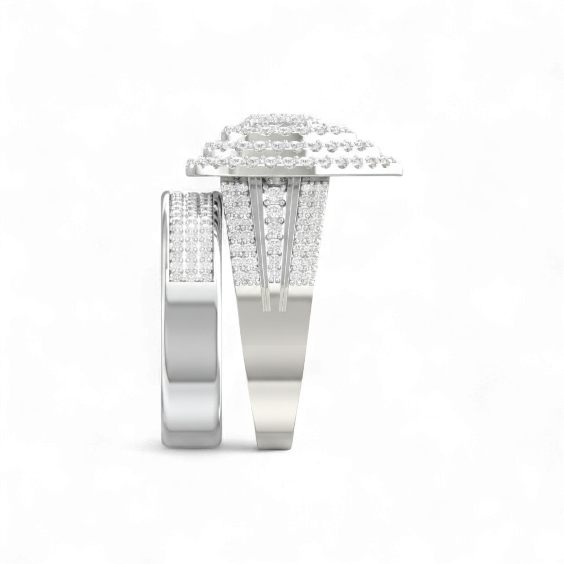 Pair of silver rings with diamond accents on a white background