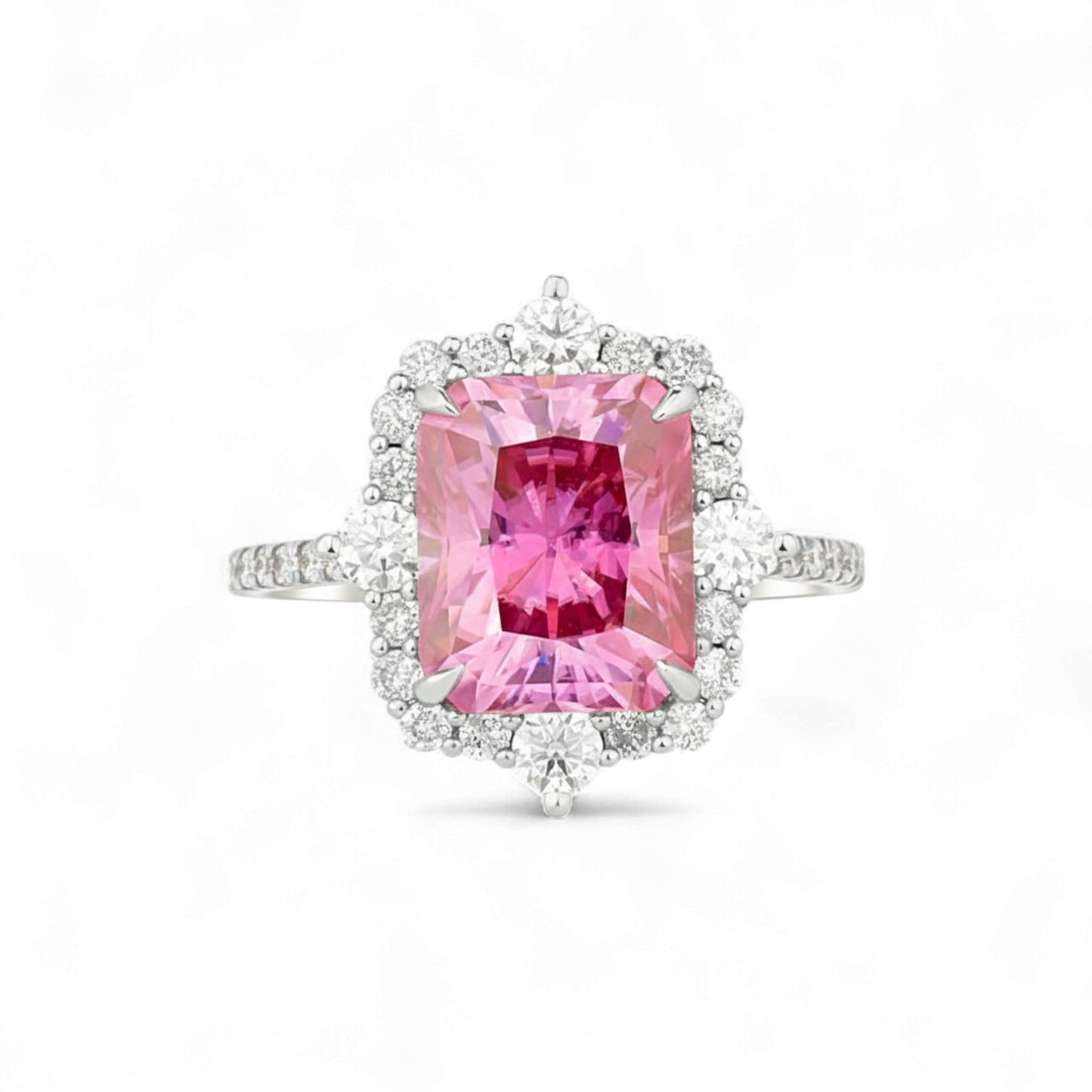 Ring with a pink gemstone and diamond accents on a white background