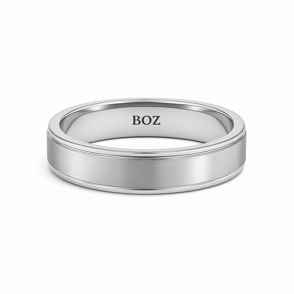 Silver ring with 'BOZ' engraving on a white background