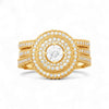 Gold ring with diamond accents on a white background
