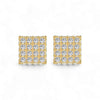 Gold square earrings with clear gemstones on a white background