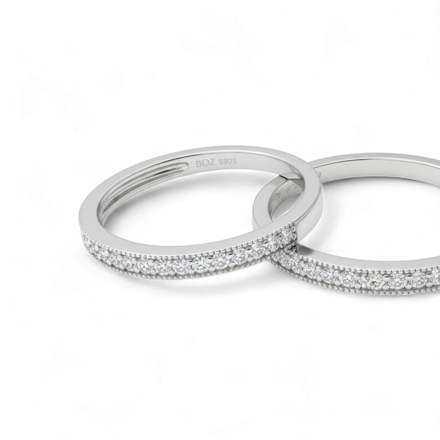 Two silver rings with diamond accents on a white background