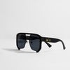 Black sunglasses with gold logo on a white background