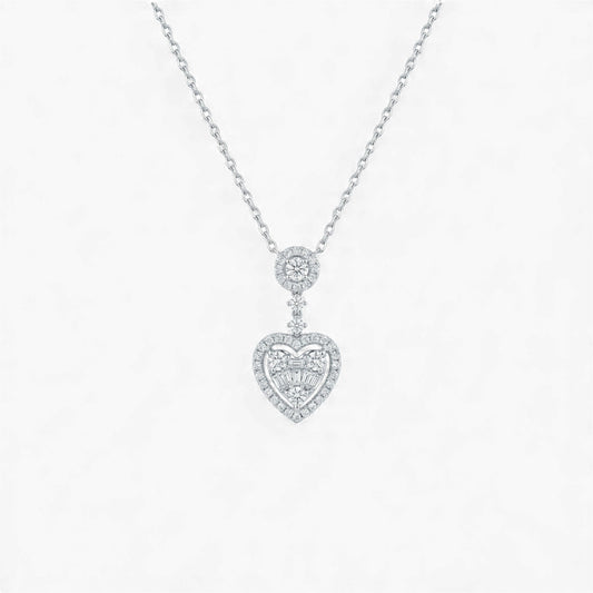 Heart-shaped diamond pendant on a chain against a white background
