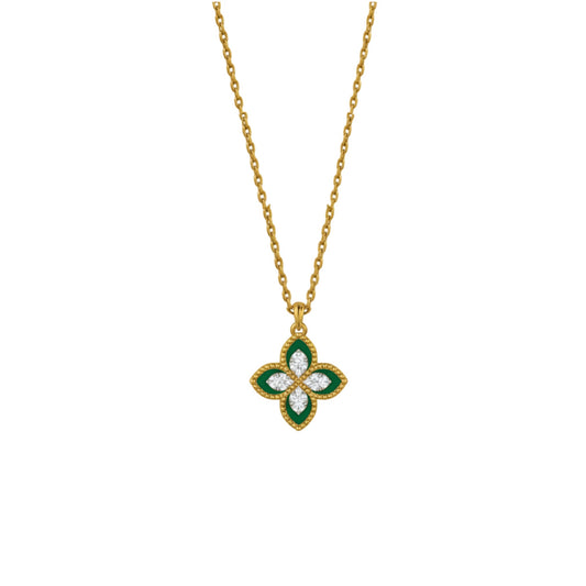 Gold necklace with a clover-shaped pendant featuring green and clear stones on a white background