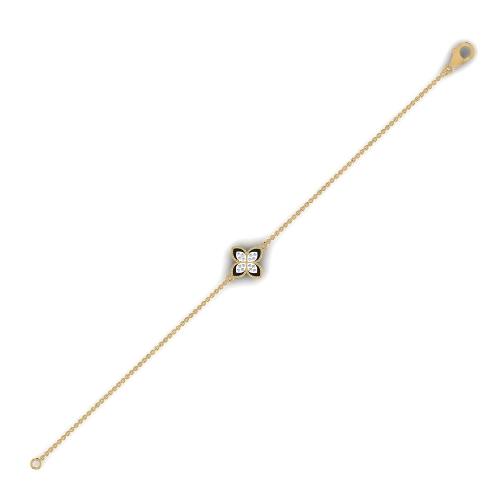 A gold-colored bracelet with a diamond clover pattern on one side, displayed against a white background.