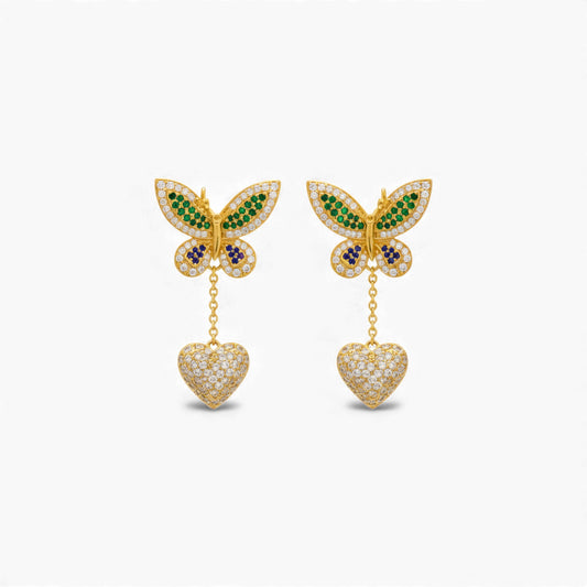 Butterfly earrings with heart pendants on a white background