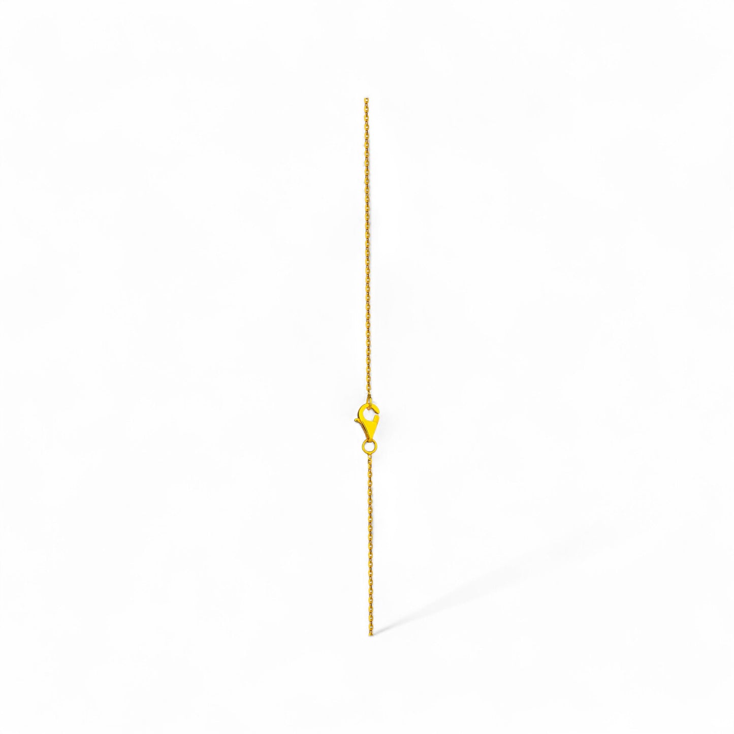 Gold chain necklace on a white background