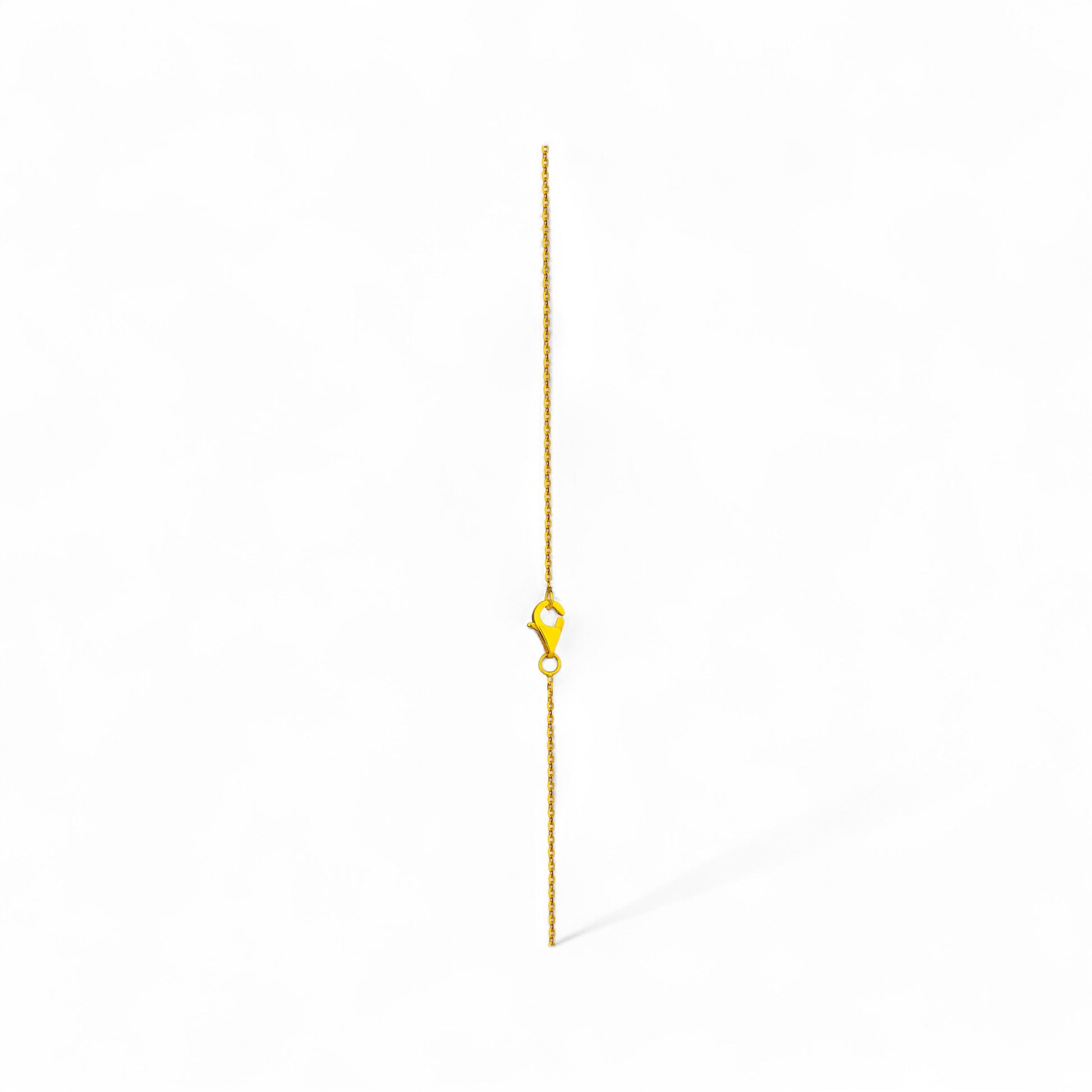 Gold chain necklace on a white background