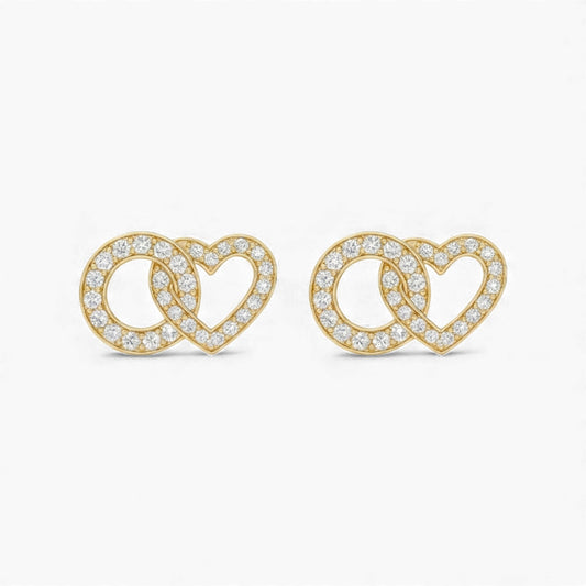 Gold heart-shaped earrings with clear stones on a white background