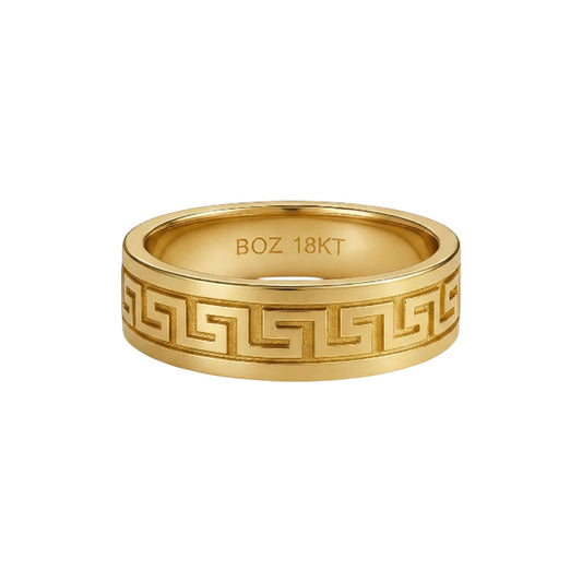 Gold ring with intricate design and 'BOZ 18KT' engraving on a white background