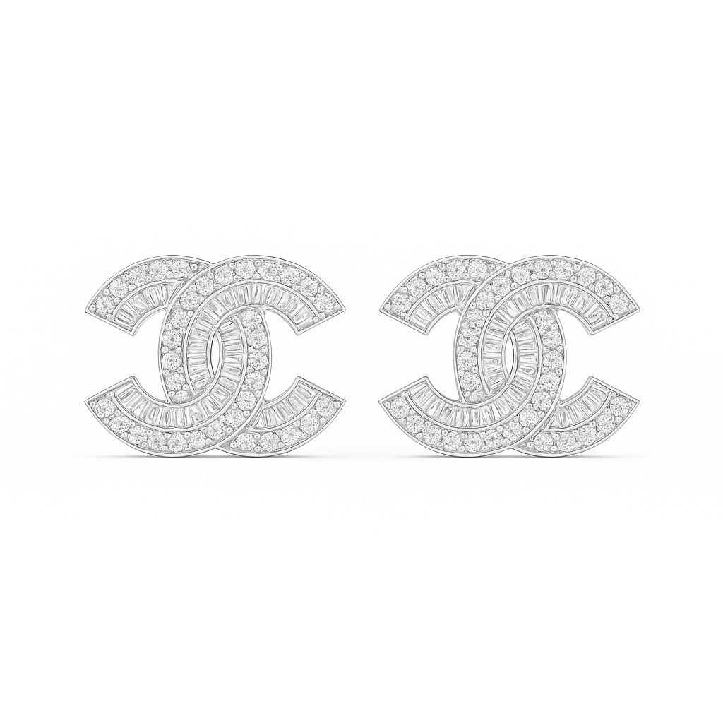 Diamond-studded Chanel earrings on a white background